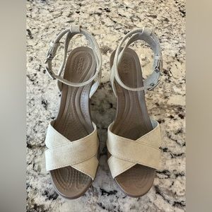Crocs ankle strap wedge sandal.